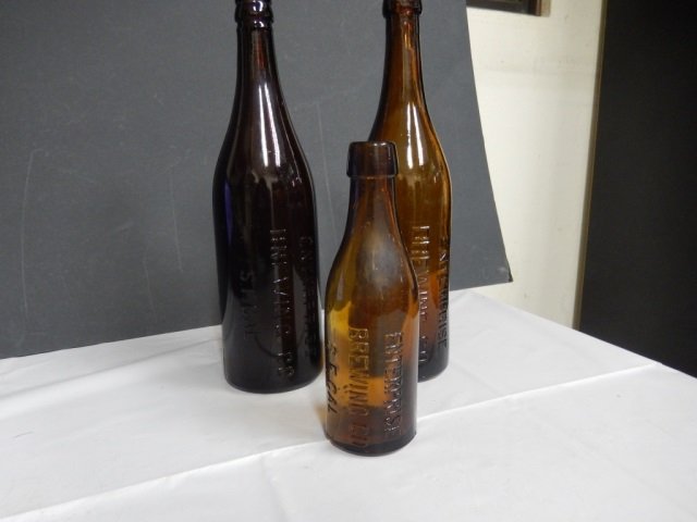 ANTIQUE BEER BOTTLES, ENTERPRISE LOT INCLUDES 3 ANTIQUE: LOT INCLUDES 3 ANTIQUE AMBER BEER BOTTLES MONOGRAMMED "ENTERPRISE BREWING CO., S.F. CAL." EACH BOTTLE IS IN EXCELLENT CONDITION. TWO BOTTLES ARE APPROX 12" TALL AND ONE IS APPROX 7.5" TALL