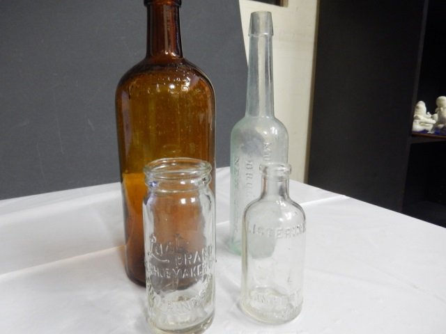 ANTIQUE WATER BOTTLES LOT INCLUDES TWO ANTIQUE WATER: LOT INCLUDES TWO ANTIQUE WATER BOTTLES. ONE CLEAR GLASS, APPROX 9" TALL MARKED "FLORIDA WATER MURRY & LANMAN DRUGISTS, NEW YORK." TWO IS AMBER, APPROX 9.5" TALL AND MARKED " WITTER SPRINGS WATER, W.M.