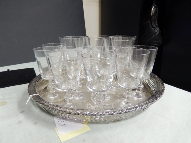 13 BACCARAT CRYSTAL STEMS LOT OF 13 BACCARAT CRYSTAL: LOT OF 13 BACCARAT CRYSTAL CUPS INCLUDES 6 SMALLER CUPS, APPROX 4.75' TALL, 5 LARGER CUPS, APPROX 5.25' TALL AND ONE ORNATE SILVERTONE SERVING TRAY, APPROX 13' DIAMETER. TRAY IS NOT STAMPED / SIGNED O