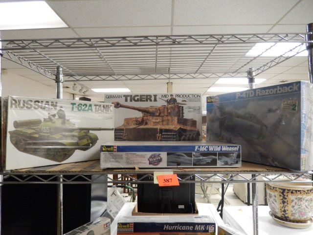 4 MODEL KITS NEW IN PLASTIC. INCLUDES: RUSSIAN TANK,: NEW IN PLASTIC. INCLUDES: RUSSIAN TANK, WILD WEASEL, TIGER i AND RAZORBACK