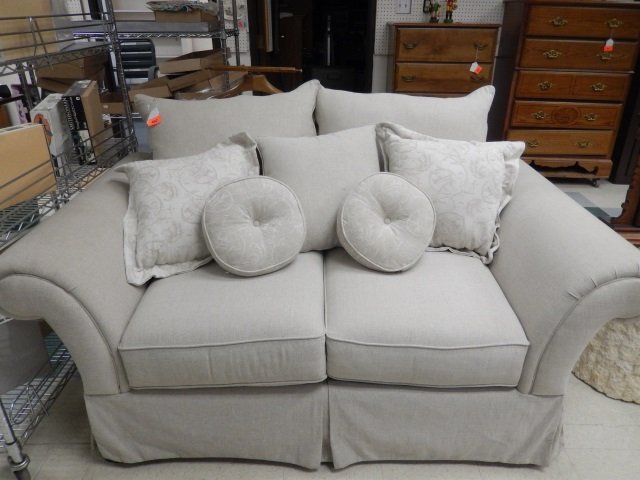 BEIGE LOVESEAT BEIGE FABRIC PILLOWBACK LOVESEAT. APPROX: BEIGE FABRIC PILLOWBACK LOVESEAT. APPROX 70" X 31" X 40"