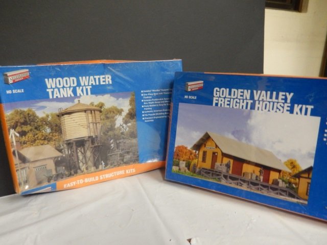 2 MODELS BY CORNERSTONE. HO SCALE NEW IN BOX AND: NEW IN BOX AND PLASTIC. LOT INCLUDES "WOOD WATER TANK KIT" AND "GOLDEN VALLEY FREIGHT HOUSE"