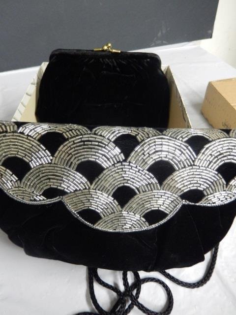 TWO CLUTCH PURSES LOT INCLUDES 2 BLACK VELVET CLUTCH: LOT INCLUDES 2 BLACK VELVET CLUTCH PURSES. 1 IS VINTAGE AND COMES WITH ITS ORIGINAL BOX