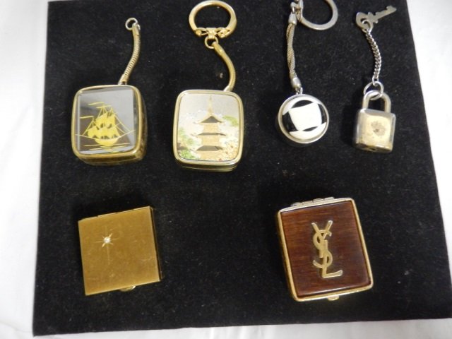 MUSIC BOXES, YSL COMPACT LOT INCLUDES TWO MINI/ KEY: LOT INCLUDES TWO MINI/ KEY RING MUSIC BOXES BY "SANKYO" ONE PILL BOX, ONE "YSL" COMPACT AND MORE!