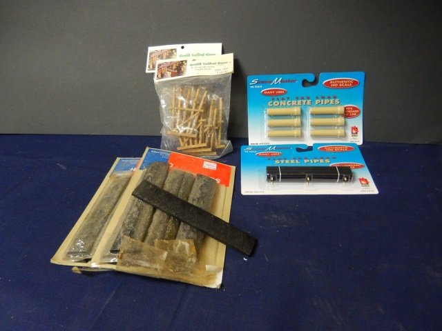 HO SCALE TRAIN DECOR: LOT INCLUDES: SCENE MASTERS (2) STEEL PIPES AND CONCRETE PIPES, GRAND CENTRAL (2) PACKS OF 5 SMALL TRESTLE BENTS, (2) PACKS OF 6 PACKS OF BETHGON COAL LOAD