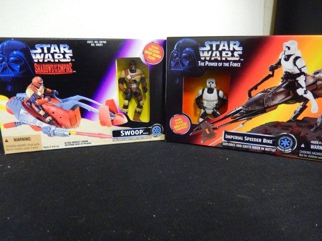 2 STAR WARS VEHICLES. MINT IN BOX: LOT INCLUDES ONE SHADOWS OF THE EMPIRE "SWOOP" WITH EXCLUSIVE SWOOP TROOPER FIGURE, CIRCA 1996. LOT ALSO INCLUDES ONE POWER OF THE FORCE "IMPERIAL SPEEDER BIKE" WITH EXCLUSIVE BIKER SCOUT, CIRCA 1995