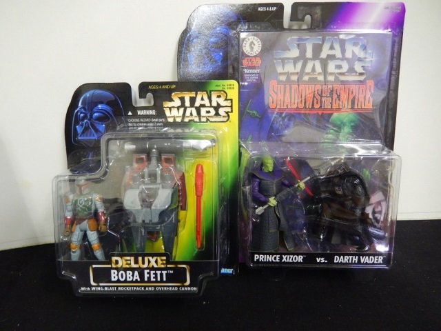 2 STAR WARS ACTION FIGURES. MINT IN BOX: LOT INCLUDES ONE DELUXE BOBA FETT (1996) AND ONE SHADOWS OF THE EMPIRE PRINCE XIZOR VS. DARTH VADAR (1996)
