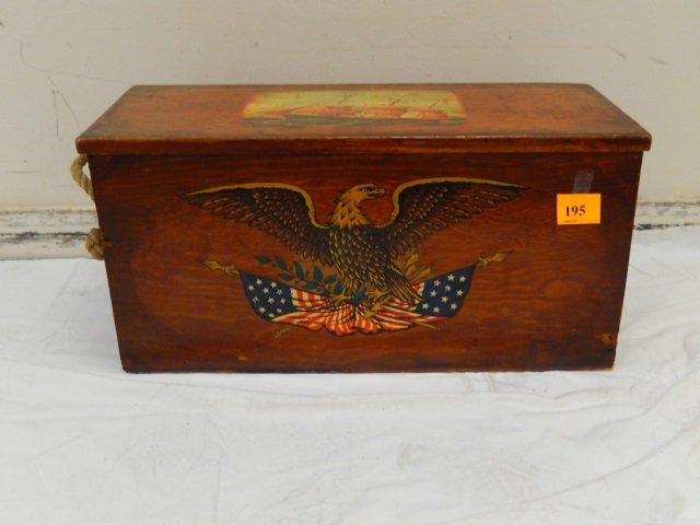 AMERICANA WOOD TOY BOX: WITH EAGLE AND FLAG EMBLEMS. BOX IS APPROX 25" X 11" X 12". ONE ROPE SIDE HANDLE IS MISSING