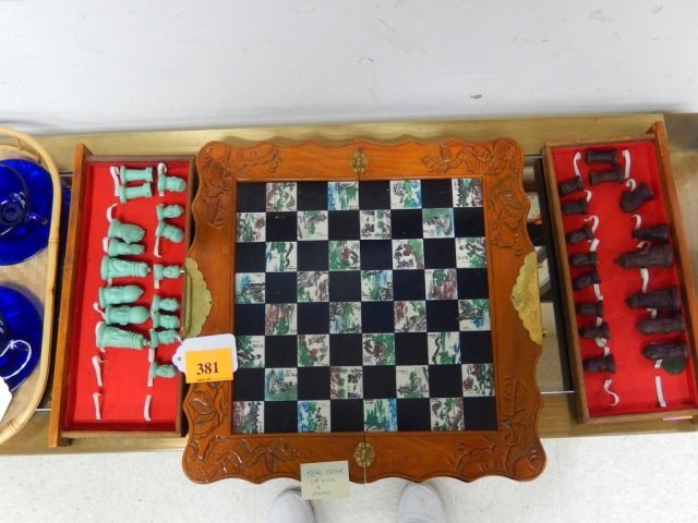 ASIAN STYLE CHESS SET TILES W/MARKINGS: 2 DRAWERS SLIDE IN CASE W PIECES, SEE PIC UNSURE IF ALL PIECES THERE, BRASS HANDLE AND DIFFERENT MOTIF TILES W MARKINGS 15 1/2" SQUAR FOLDS IN HALF FOR CARRYING