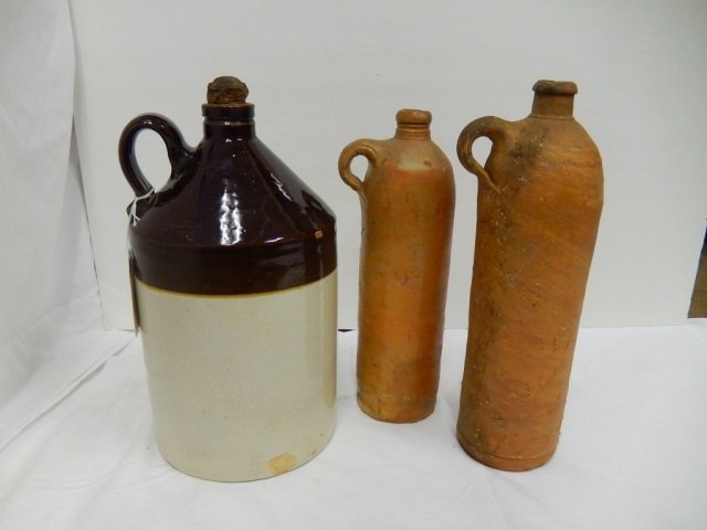 CROCK & WINE CROCKS (3): LARGER CROCK HAS STOPPER AND A FEW CHIPS 2 WINE CROCKS ARE MARKED"SELTERS-NASSAU HAS A FEW CHIPS