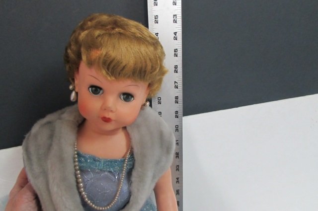 VINTAGE DOLL W/MOVEABLE EYES NOT SURE NAME HEELS,: NOT SURE NAME HEELS, EARRINGS, NECKLACE MARKED 69 29" TALL