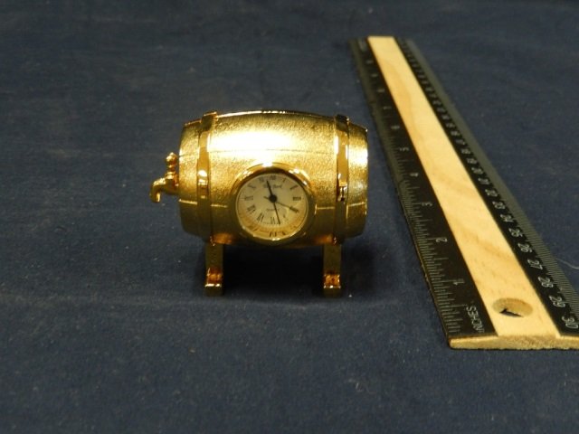 NOVELTY DESK CLOCK SHAPE OF A WINE BARROW, BATTERY: SHAPE OF A WINE BARROW, BATTERY OPERATED QUARTZ, 2 1/2 INCHES LONG