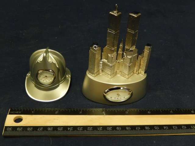 2 NOVELTY CLOCKS ONE SILVERTONE HELMET AND ONE CITY: ONE SILVERTONE HELMET AND ONE CITY SCAPE