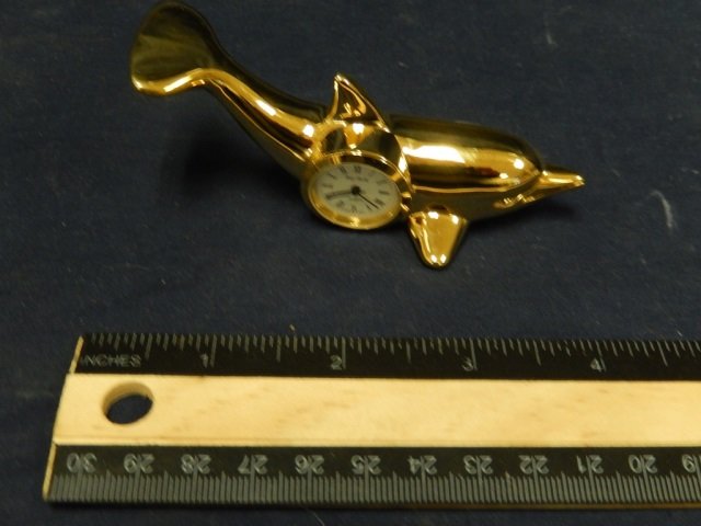 BRASS DOLPHIN SHAPED DESK CLOCK BATTERY OPERATED QUARTZ: BATTERY OPERATED QUARTZ 4 IN LONG