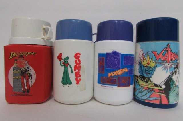 4 VINTAGE PLASTIC THERMOS BOTTLES 1984 INDIANA JONES,: 1984 INDIANA JONES, 1989 GUMBY, 1984 VOCTRON, & 1996 MONSTARS