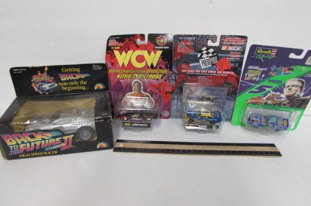 4 COLLETIBLE TOY CARS Vintage ALL ARE IN ORIGINAL: ALL ARE IN ORIGINAL PACKAGING, BACK TO THE FUTURE PART II HIGH SPEED RACER, (2) RACING CHAMPIONS, & REVELL RACING CAR