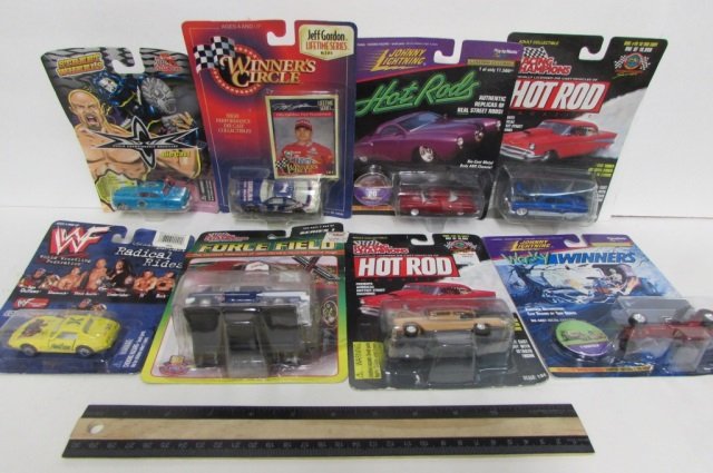 VARIOUS COLLECTIBLE TOY CARS (8) A VARIETY OF 8: A VARIETY OF 8 COLLECTIBLE CARS, ALL IN ORIGINAL PACKAGING. (2) JOHNNY LIGHTNING: "HOT RODS" & "WACKY WINNERS," (3) RACING CHAMPIONS: "HOT ROD" (x2) & "FORCE FIELD," "STREET WHEELS: WCW," "WINNER'S CI