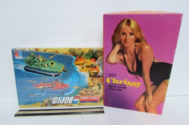2 VINTAGE JIGSAW PUZZLES (SUZANNE SOMERS,G.I. JOE) BOTH: BOTH IN ORIGINAL PACKAGING. "G.I. JOE MURAL PUZZLE: BATTLE 4" (1985) & SUZANNE SOMERS AS CHRISSY FROM "THREE'S COMPANY" PUZZLE (1978)