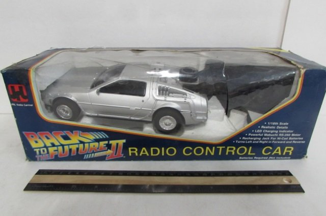 BACK TO THE FUTURE RADIO CONTROL CAR ORIGINAL PACKAGING: ORIGINAL PACKAGING IS SLIGHTLY DAMAGED, 1/18TH SCALE, REALISTIC DETAILS, LED CHARGING INDICTOR