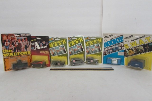 7 VINTAGE ASSORTED COLLECTIBLE CARS ALL ARE IN ORIGINAL: ALL ARE IN ORIGINAL PACKAGING, THE A-TEAM, MASH, ROOKIES, SWAT, & THE WALTONS