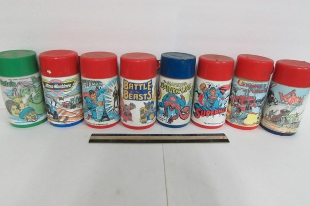 8 VINTAGE PLASTIC THERMOS BOTTLES 1986 SUPERMAN, 1984: 1986 SUPERMAN, 1984 TRANSFORMERS, 1984 VOCTRON, 1980 MARVEL COMICS GROUP, 1980 SUPERMAN, 1989 MICRO MACHINES, PETE'S DRAGON, & 1986 BATTLE BEAST