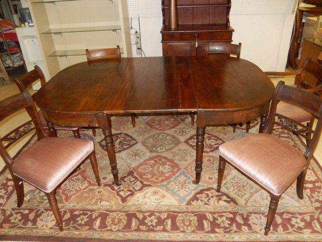 MAHOGANY TABLE AND 6 CHAIRS UPHOLSTERED VELOUR CHAIRS,: UPHOLSTERED VELOUR CHAIRS, TABLE MEASURES 50 BY 74 INCHES AND INCLUDES ONE LEAF, TABLE HAS 6 LEGS, CARVED LEGS. TABLETOP SHOWS WEAR, CHAIRS HAVE CARVED BACK DESIGN