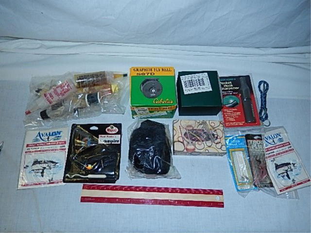FISHING EQUIPMENT 567 D CABELA'S GRAPHITE REEL, POCKET: 567 D CABELA'S GRAPHITE REEL, POCKET HOOK SHARPENER, HOOKS, AVALON LINE, HUNTER GREEN REEL, TROUT FLYS, VAMPIRE FLYS, ROD BUILDERS GLUE, RUBBER BANDS, BLACK VELOUR LINE