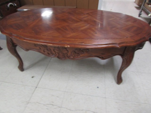 OAK OVAL COFFEE TABLE 48" X 28", TABLE SHOWS WARE: 48" X 28", TABLE SHOWS WARE