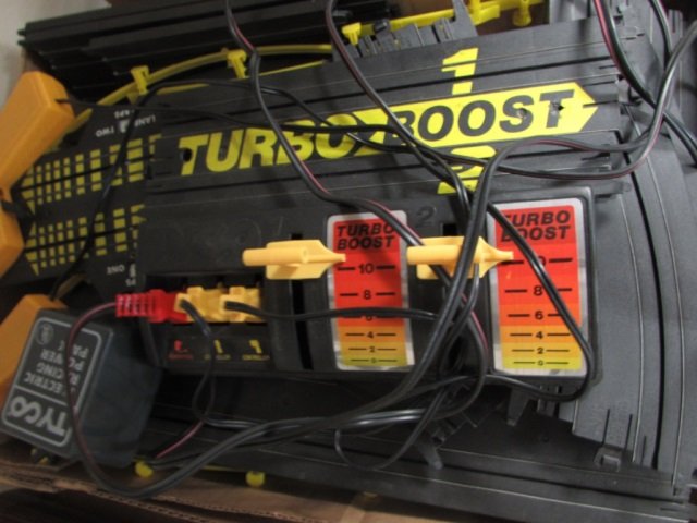 TYCO ELECTRIC RACING POWER PACK INCLUDES RACE TRACK AND: INCLUDES RACE TRACK AND CONTROLS