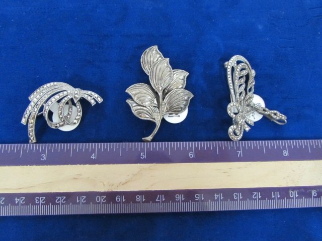 STERLING SILVER BROOCHES (3): BEAU STERLING BROOCH AND (2) MARCASITE BROOCHES