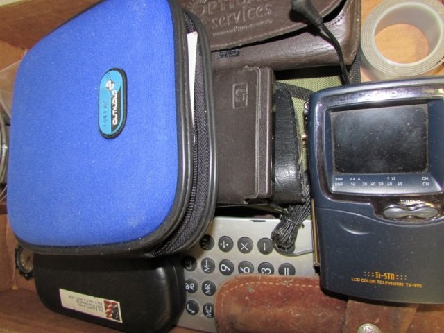 CALCULATORS, SPORTS WATCH,AND MORE: POCKET KNIFE, READING GLASSES, MINI CASIO COLORED TV 5" , CD HOLDER WITH BUILT-IN SPEAKER, CREDIT CARD HOLDER.