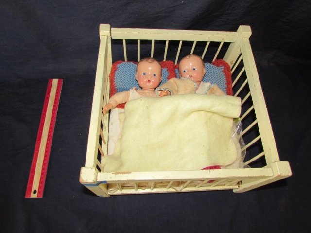 VINTAGE EFFANBEE DOLLS AND CRIB COMPOSITION HEAD AND: COMPOSITION HEAD AND HANDS, CLOTH BODY AND FEET, TWIN BABY DOLLS IN VINTAGE CLOTHES AND BEDDING. 9.5" LONG. WHITE VINTAGE TOY DOLL CRIB SHOWS WEAR, MEASURES 12.5 WIDE BY 7.5 INCHES TALL BY 12 INCHES D