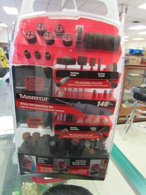 MASTER CUT ROTARY TOOL ACCESSORY KIT: IN PLASTIC STORAGE CONTAINER THAT IS ABLE TO STAND UP OR BE HUNG ON WALL, FEW PIECES MISSING