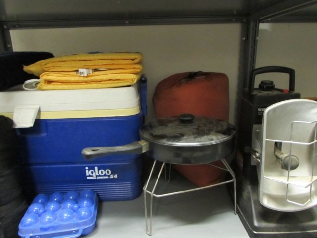 CAMPING SUPPLIES: INCLUDES SLEEPING BAG, FRYING PAN AND STAND, LARGE IGLOO COOLER, PROPANE RADIANT HEATER, BLANKETS
