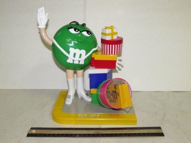 PLASTIC M&M CANDY DISPENCER: PLASTIC M&M CANDY DISPENCER TAXI THEMED, ONE M&M CHARACTER, GREAT CONDITION