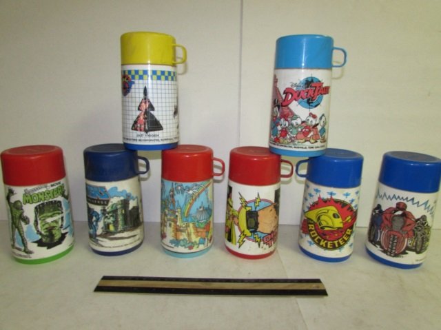 VINTAGE PLASTIC THERMOS BOTTLES (8): VINTAGE PLASTIC THERMOS BOTTLES (8) DICK TRACY, MASTERS OF THE UNIVERSE, MONSTERS, ROCKETEER, DUCK TALES, MAGIC KINGDOM, RING RAIDERS, & POWER RANGERS