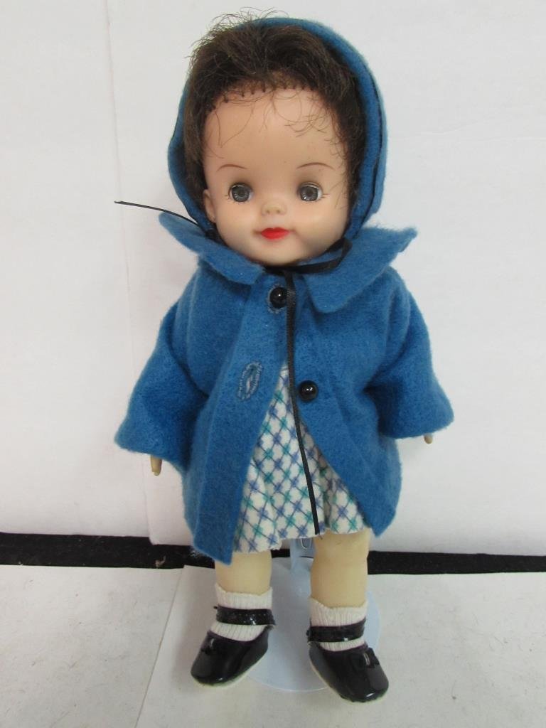 EFFANBEE RUBBER BABY DOLL: 10" LONG, SOFT RUBBER HEAD AND BODY, BLUE SLEEPY EYES, BROWN WIG, BLUE FELT JACKET AND HOOD, GOOD CONDITION