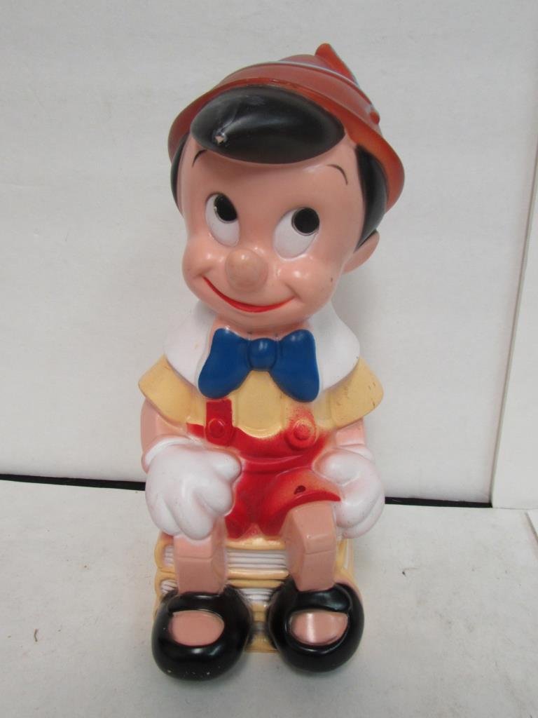 PINOCCHIO MOLDED PLASTIC BANK: 12" TALL, MISSING THE BOTTOM STOPPER, IN GOOD CONDITION, MARKED WALT DISNEY PLAY PAL PLASTICS INC