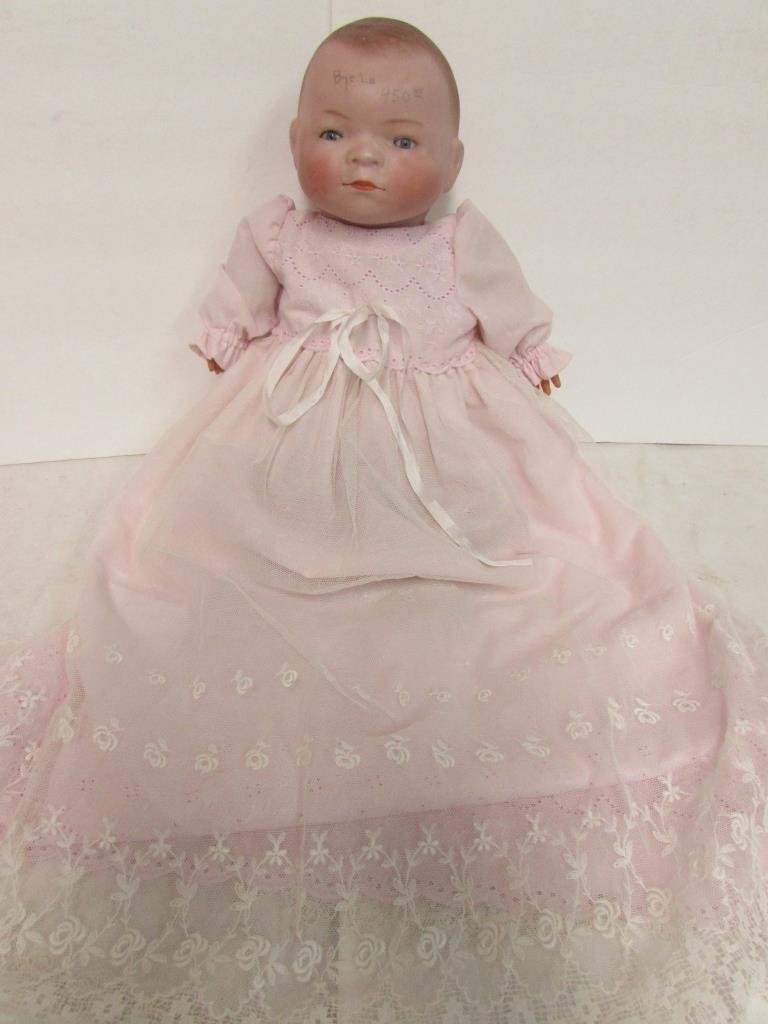 GRACE S. PUTNAM DOLL: 14" LONG, BISQUE HEAD, COMPOSITION HANDS, CLOTH BODY AND LEGS, DROWN MOLDED HAIR, BLUE GLASS SLEEPY EYES, MARKED COPY BY GRACE S. PUTMAN MADE IN GERMANY, SQUEEKER DOLL BUT DOES NOT WORK