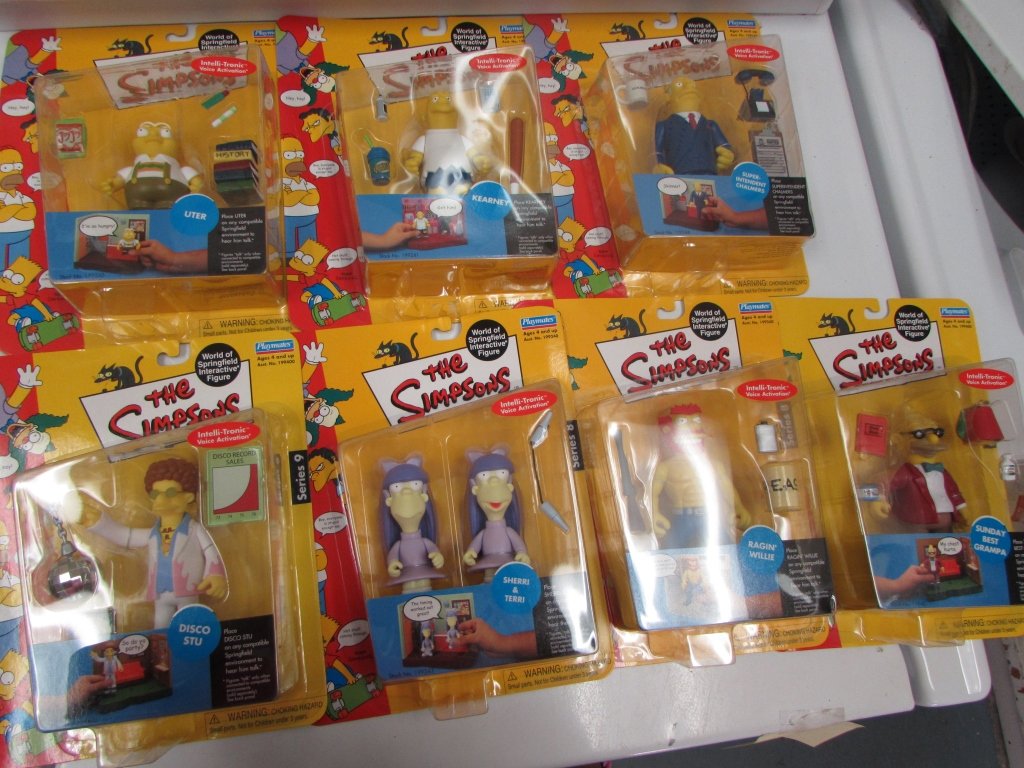 SIMPSONS COLLECTIBLE TOYS (7): SIMPSONS COLLECTIBLE TOYS (7) IN ORIGINAL PACKAGING, INCLUDES SUPERINTENDENT CHALMERS, KEARNEY, UTER, SHERRI & TERRI, RAGIN' WILLIE & SUNDAY BEST GRAMPA & DISCO STU