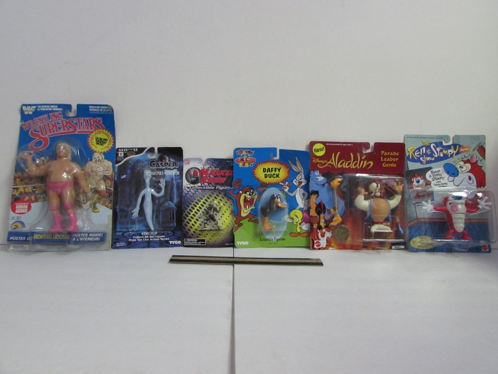 ASSORTED COLLECTIBLE ACTION FIGURES (6): ALL ARE IN ORIGINAL PACKAGING, THE REN & STIMPY SHOW FIGURES, ALADDIN PARADE LEADER GENIE, DAFFY DUCK, MASKED RIDER, CASPER STRETCH FIGURE, & WRESTLING SUPERSTARS ADRIAN ADONIS FIGURE