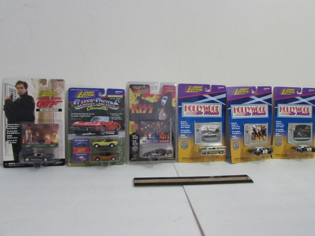 JOHNNY LIGHTNING COLLECTIBLE CARS (6): ALL ARE IN ORIGINAL PACKAGING, CLASSIC CUSTOMS, JAMES BOND OO7, KISS, & HOLLYWOOD ON WHEELS