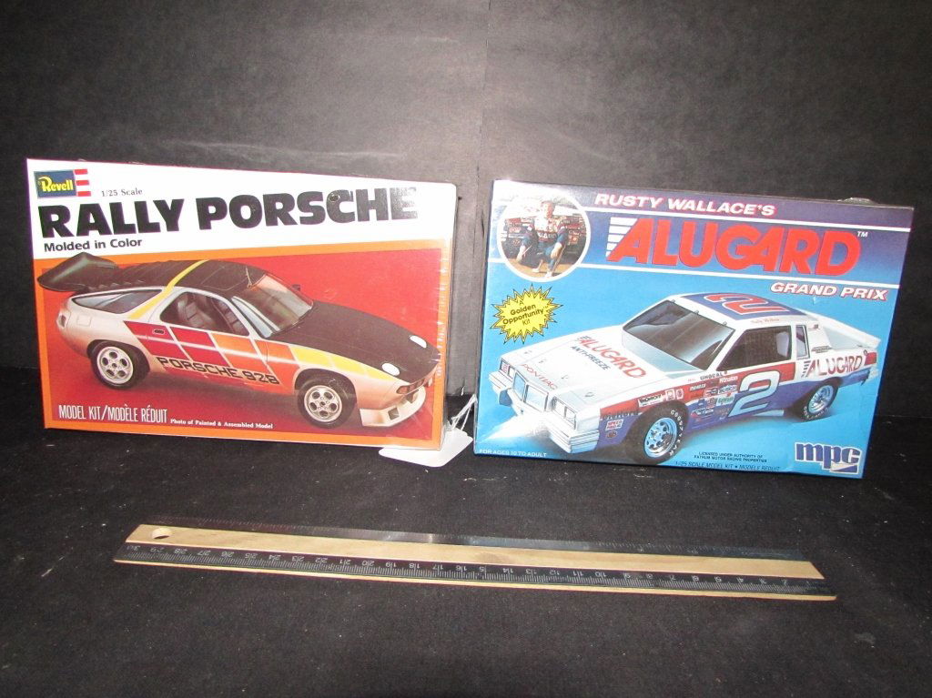 2 PLASTIC CAR MODEL KITS: RUSTY WALLACE GRAND PRIX & RALLY PORSHE, BOTH ARE IN ORIGINAL PACKAGING