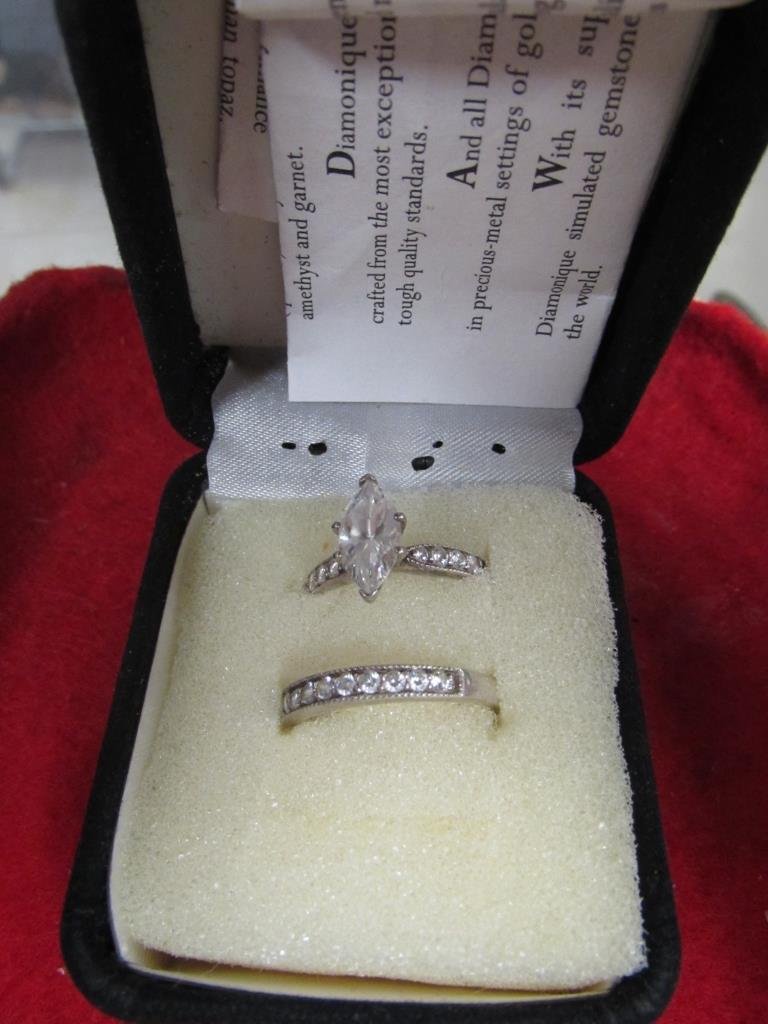 WEDDING RING SET: WEDDING RING SET MAIN STONE IS NOT AUTHENTIC DIAMOND, SMALL STONESTESTED TO BE DIAMONDS, MARKED 925 THAILAND