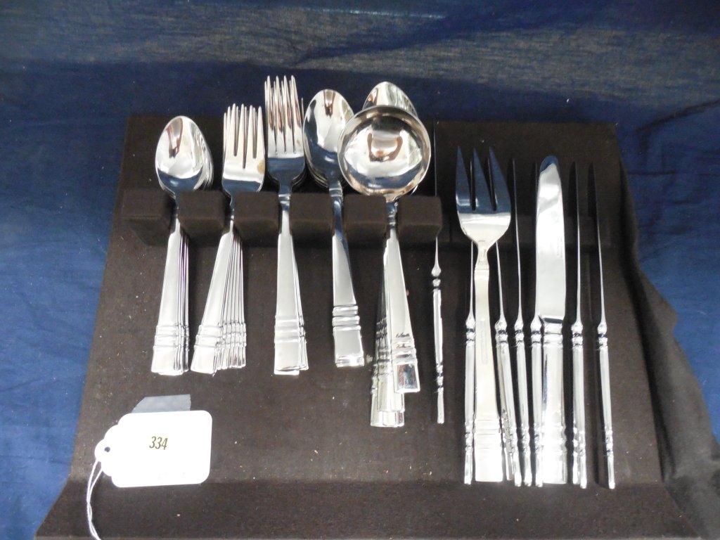 COOK'S ESSENTIALS FLATWARE (45): COOK'S ESSENTIALS FLATWARE (45) EIGHT 5-PIECE PLACESETTINGS WITH 5 SERVING PIECES. COOK'S STAINLESS STEEL SET, INDONESIA WITH TARNISH PROOF LINER