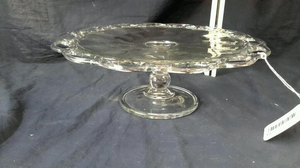 Clear glass cake stand: Clear glass cake stand 4.5 inches tall 12 inches at it's widest with lace work border