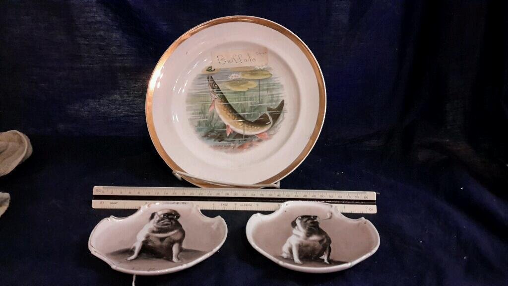 Buffalo Pottery and German Decorative Plates (3): Buffalo Pottery fish plate is signed RK Beck and is 9.25" in diameter. 2 small plates are stamped made in Germany and are 5 " in diameter. Fair condition, some paint ware on dog plates and s
