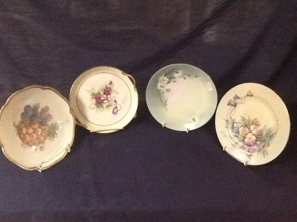 Hand Painted Porcelain Plates (4): Range in size from 7.5" to 8". Marked Czech, Nippon, Bavaria, and others.