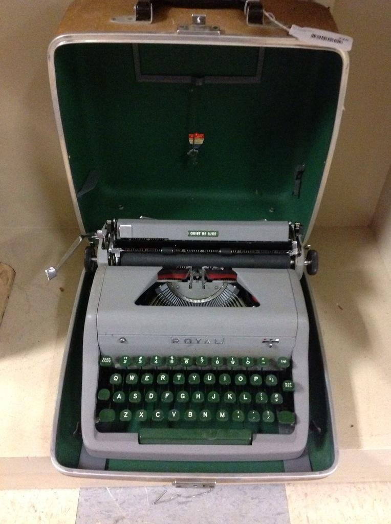 Royal Manual Portable Typewriter with Case: Case shows wear but in good condition.