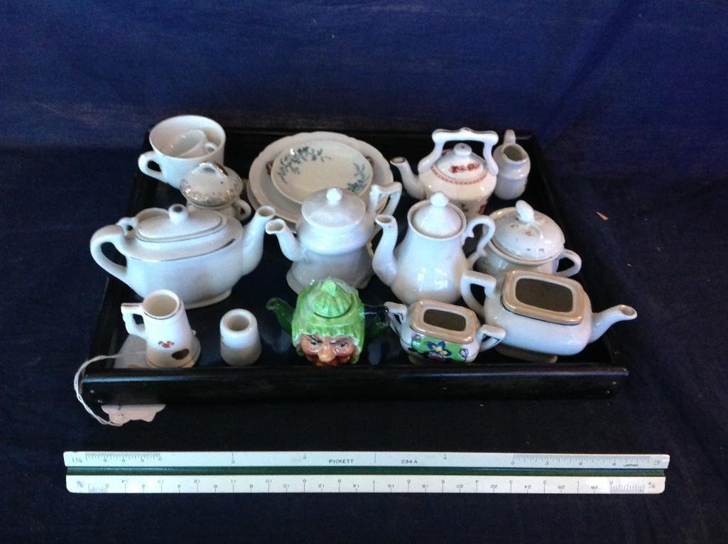 Children's Vintage Tea Set Assortment: Large assortment of child sized ceramic Vintage tea sets. Some stamped Germany and some are stamped England. Assortment includes many different styles and sizes. Mostly in good condition, one cup has